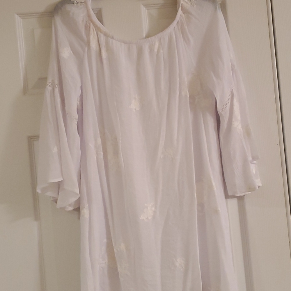 White dress with embroidered flowers and